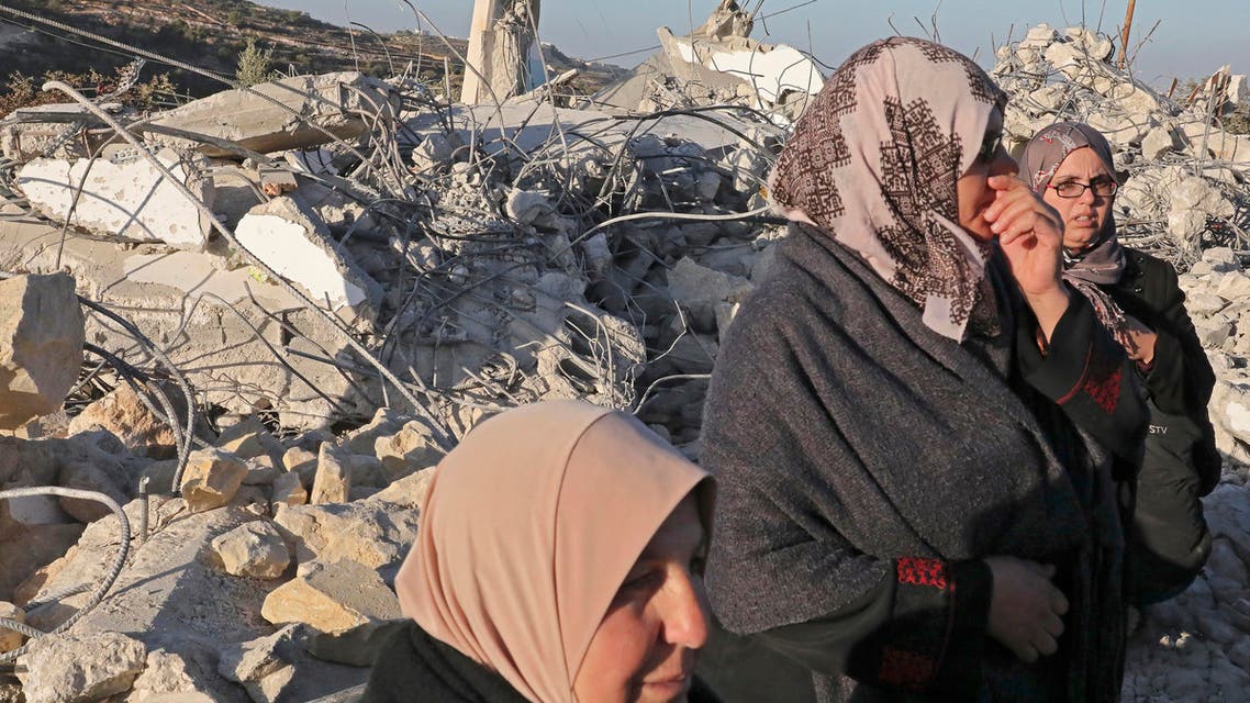 Palestinians check the house of a man who reportedly carried out an attack against Israelis in August, after it was demolished by Israeli authorities on November 28, 2019 - AFP
