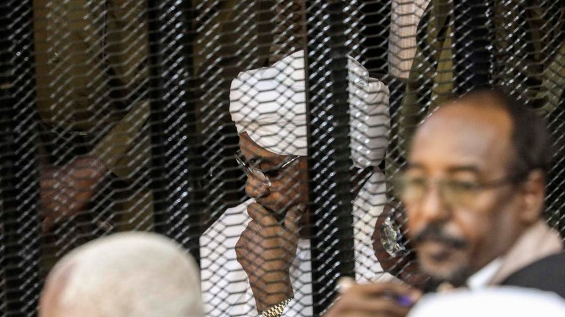 Sudan's former President Omar al-Bashir sits in a cage during his trial on corruption and money laundering charges. (File photo: AP)