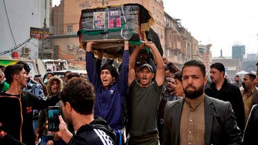 Mourners carry the coffin of Mehdi Kadim, 17, a protester killed during anti-government demonstrations, during his funeral in Najaf, Iraq, Friday, Nov. 29, 2019. (AP)