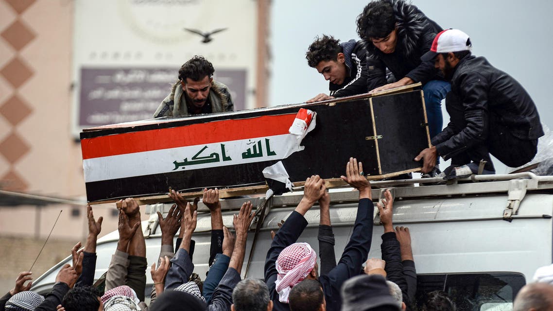 Iraqi mourners coffin flag protesters November 28, 2019, Najaf - AFP