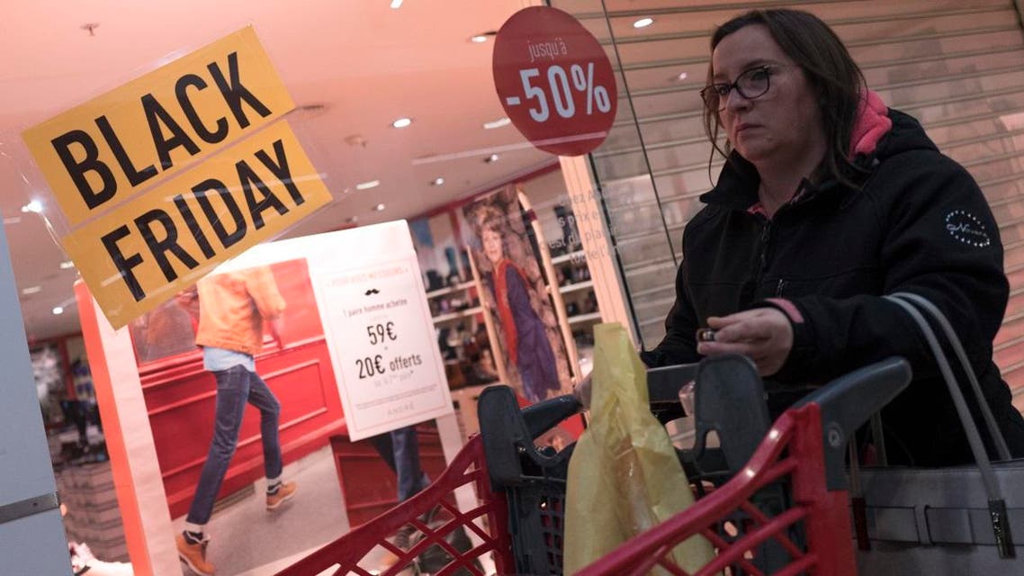 A shopper is seen during the opening of an Auchan general store, on Black Friday, Nov 29, 2019, in Englos, northern France. (AP)