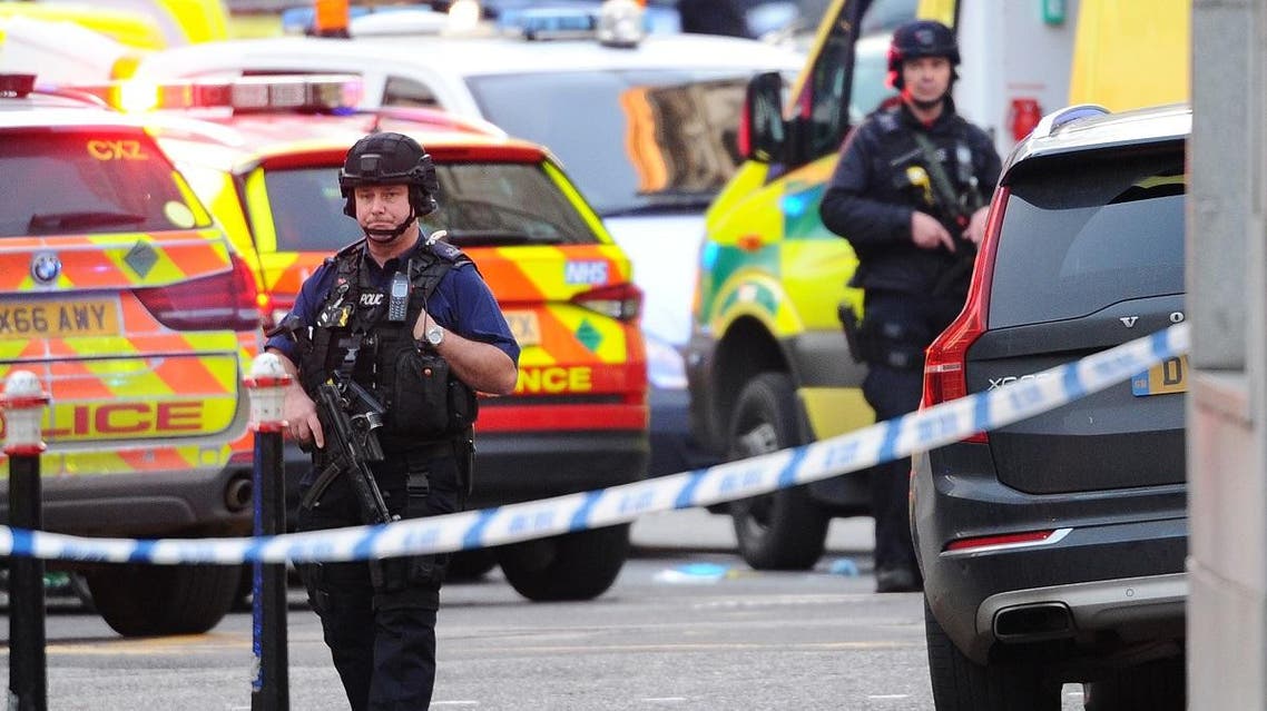 Armed police stand guard near The Monument in London, on November 29, 2019 after reports of shots being fired on London Bridge. (AFP)