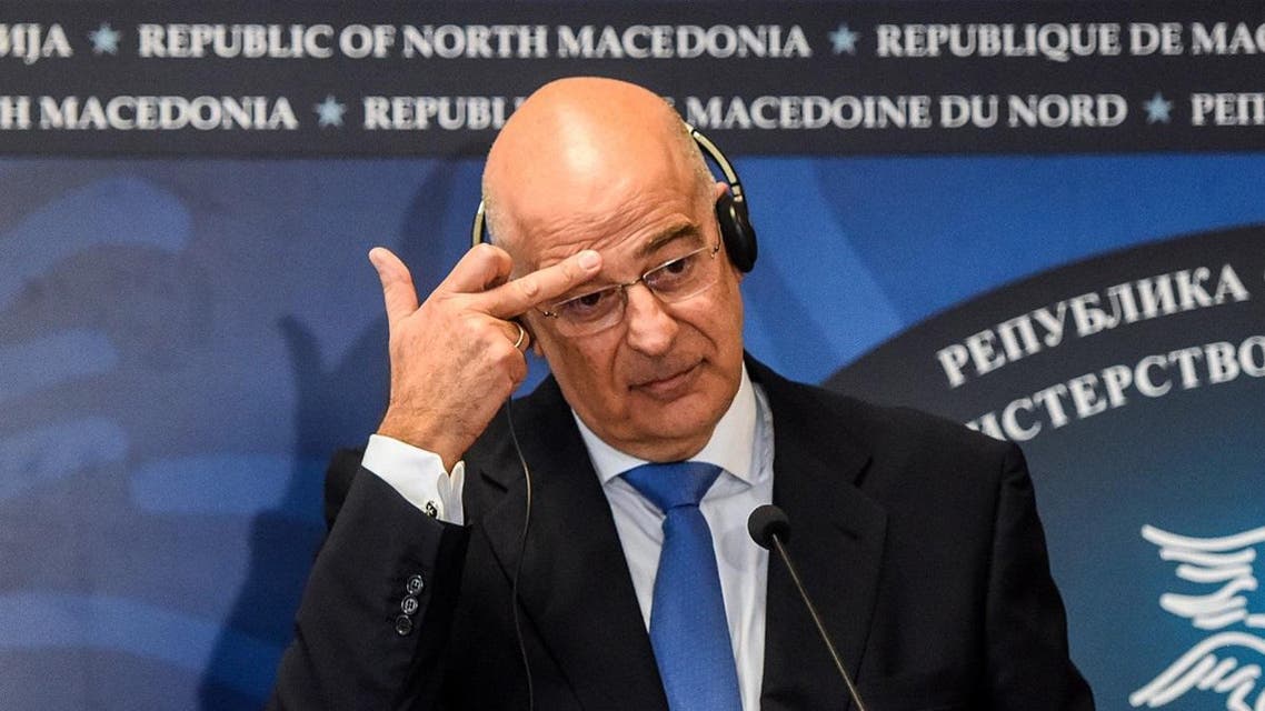 Greece’s Minister of Foreign Affairs Nikos Dendias gestures during a press conference with North Macedonia's Foreign Minister as he arrives in Skopje for a one-day visit of the country, on November 26, 2019. (AFP)