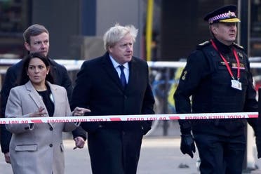 UK Prime Minister Boris Johnson, c), Home Secretary Priti Patel, (L) and Commissioner of the City of London Police, Ian Dyson (R) arrive at the scene of a stabbing on London Bridge in the City of London. (File photo: AFP)