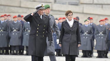 German Defense Minister Annegret Kramp-Karrenbauer and Vice Admiral and Deputy Inspector General of the German Armed Forces Bundeswehr, Joachim Georg Ruehle (L) inspect the guard on November 12, 2019 in front of the Reichstag building, which houses the Bundestag in Berlin. (AFP)