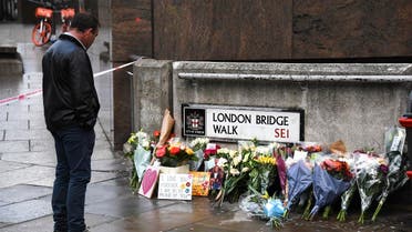 Flowers and a pictures are left in memory of Jack Merritt, who is the first victim to be named following Friday’s terror attack on London Bridge in London, on December 1, 2019. (AP)