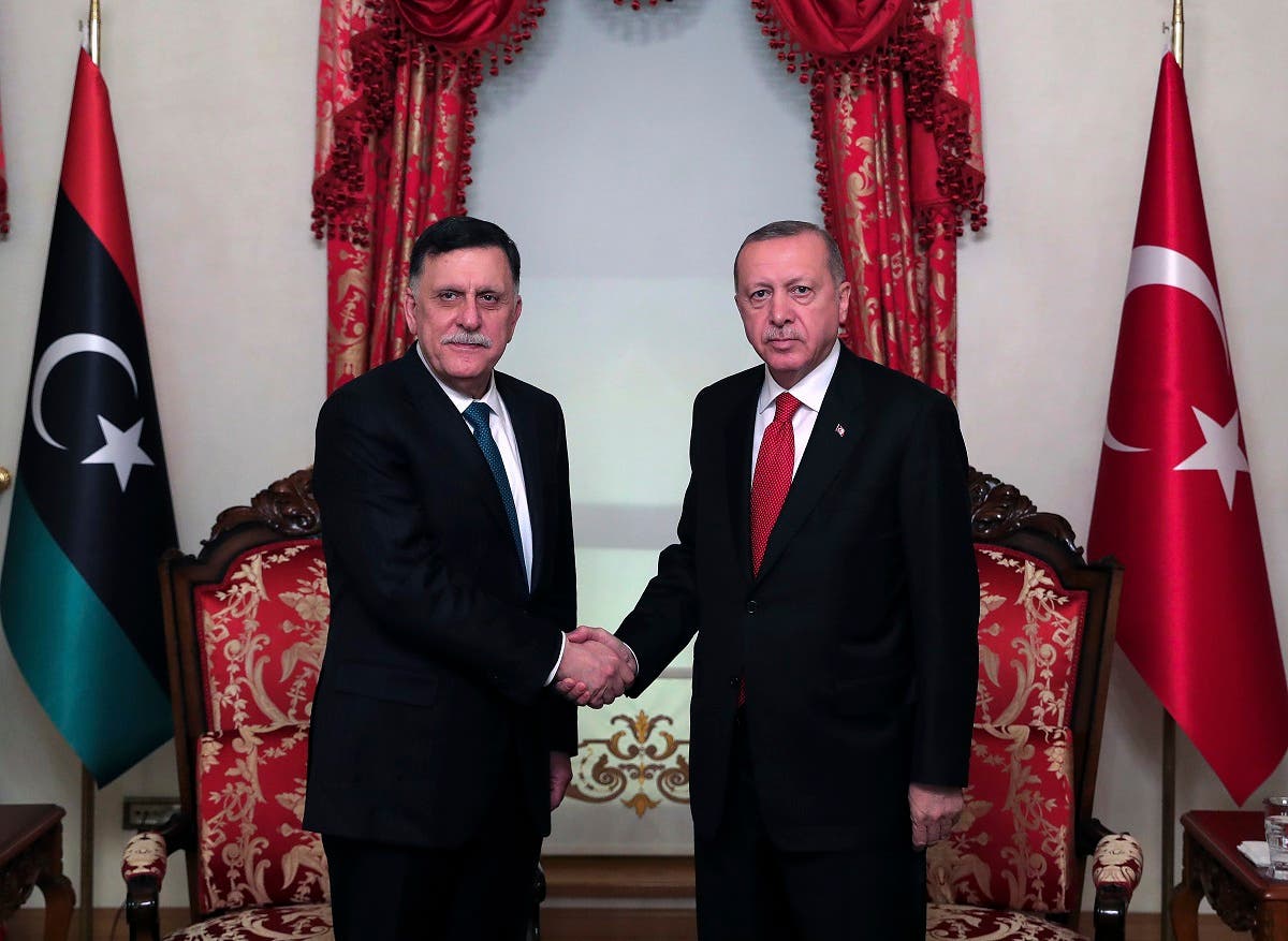 Turkey's President Recep Tayyip Erdogan, right, shakes hands with Fayez al Sarraj, left, the head of Libya's GNA, prior to their meeting in Istanbul on Nov. 27, 2019. (AP)