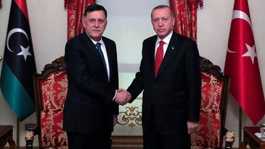 Turkey's President Recep Tayyip Erdogan, right, shakes hands with Fayez al Sarraj, left, the head of Libya's internationaly-recognized government, prior to their meeting in Istanbul, Wednesday, Nov. 27, 2019. (AP)