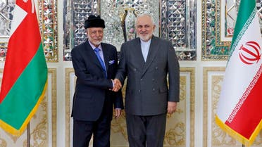 Iran's Foreign Minister Mohammad Javad Zarif (R) welcomes Oman's Minister of State for Foreign Affairs Yusuf bin Alawi bin Abdullah in Tehran on December 2, 2019. (AFP)