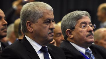 Algeria's Prime Minister Abdelmalek Sellal (L) and Rally for National Democracy (RND)'s interim secretary general, Ahmed Ouyahia, attend an extraordinary meeting of the RND on May 5, 2016, in the capital Algiers. AFP