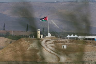 Soldiers stand guard in a watchtower flying Jordanian flags, in the area of Baqoura near the Israeli-Jordanian, border, on Wednesday, Nov. 13, 2019. (AP)