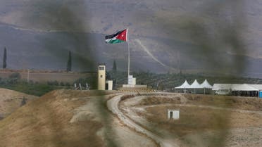 Soldiers stand guard in a watchtower flying Jordanian flags, in the area of ​​Baqoura near the Israeli-Jordanian, border, on Wednesday, Nov. 13, 2019. (AP)