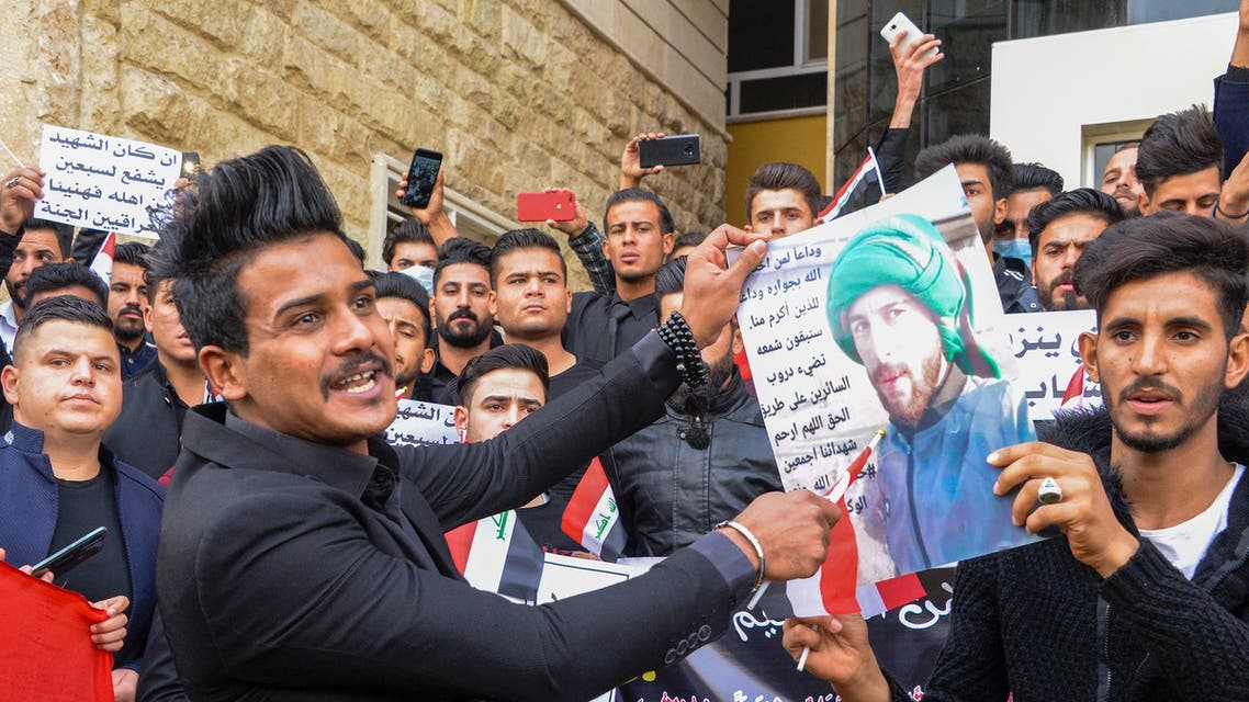 Students take part in a gather at the Mosul University to mourn protesters killed in anti-government rallies in the northern city of Mosul on December 1, 2019.