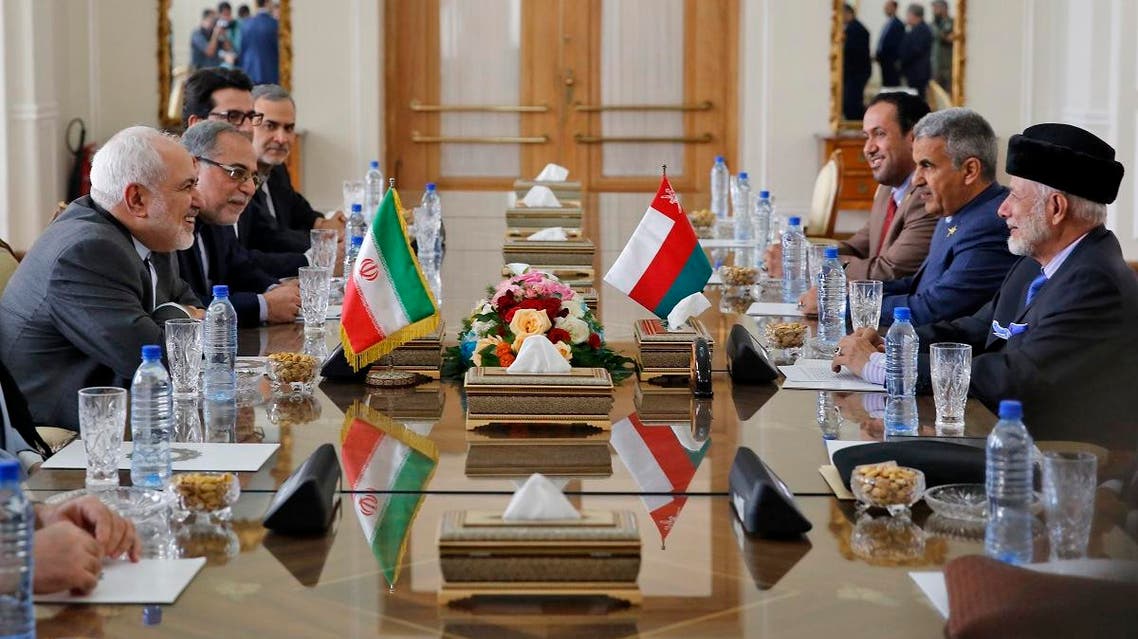 Iran's Foreign Minister Mohammad Javad Zarif (L) meets with Oman's Minister of State for Foreign Affairs Yusuf bin Alawi bin Abdullah (R) in Tehran on December 2, 2019. (AFP)