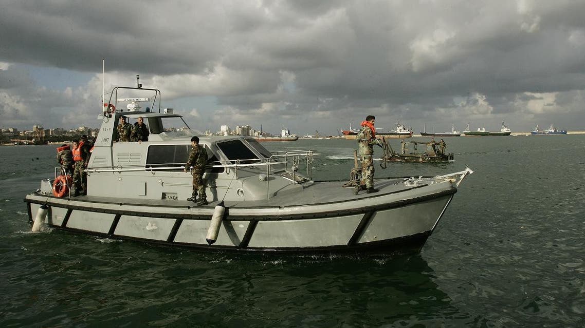 A Lebanese army boat carrying survivors of a ship accident off the Lebanese waters docks at the port of Tripoli in northern Lebanon on December 18, 2009. (AFP)