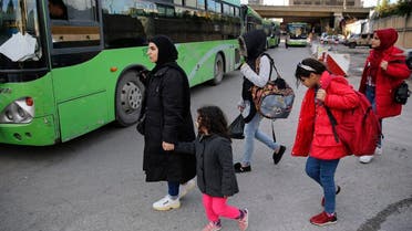 Syrian refugees prepare to board a bus to take them home to Syria, in Beirut, Lebanon, Tuesday, December 3, 2019. (AP)