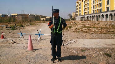 A Chinese police officer takes his position by the road near what is officially called a vocational education center in Yining in Xinjiang Uighur Autonomous Region, China (File photo: Reuters) 