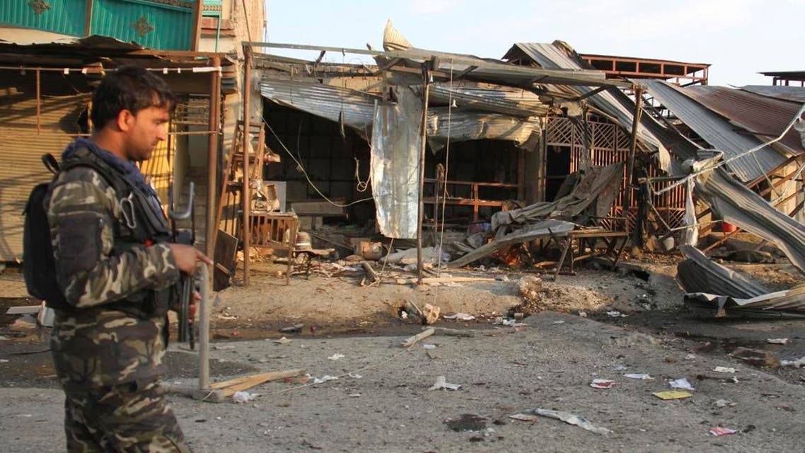 An Afghan security personnel arrive at the site of suicide attack in Jalalabad east of Kabul, Afghanistan, Friday, Oct. 25, 2019. An Afghan official says a suicide attack has targeted a convoy carrying officials from the country's intelligence service, killing five people, including a child, in eastern Nangarhar province. The Taliban claimed the attack. (AP Photo/Wali Sabawoon)