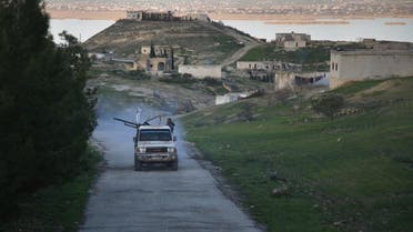 An armed vehicle driven by Turkey-backed Syrian fighters is seen in a village overlooking the Euphrates river near the rebel-held border town of Jarabulus in northern Syria. (File photo: AFP)