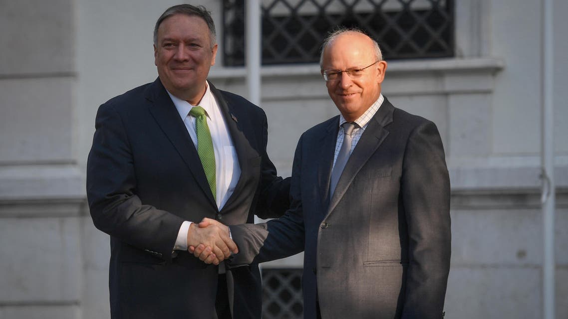 US Secretary of State Mike Pompeo (L) is welcomed by Portuguese Foreign Affairs Minister Augusto Santos Silva (R) at Sao Bento Palace in Lisbon on December 5, 2019. 
