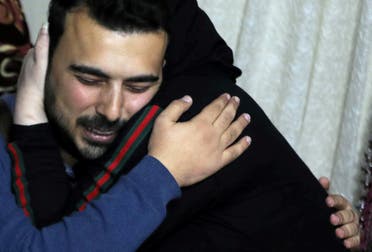 Palestinian journalist, Amjad Yaghi, hugs his mother, Nevine Zouheir, after 20 years of separation, in Banha, Egypt December 2, 2019. Picture taken December 2, 2019. REUTERS