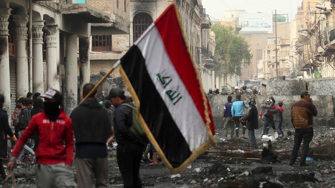 Anti-government protesters gather during clashes with security forces on Rasheed Street in Baghdad, Iraq, Friday, Dec. 6, 2019. (AP)