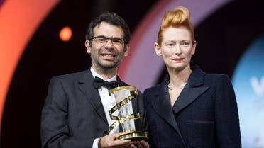 Colombian director Nicolas Rincon Gille (L) stands with British actress Tilda Swinton as he holds his trophy of the “Etoile d’or” on December 7, 2019, in Marrakech. (AFP)