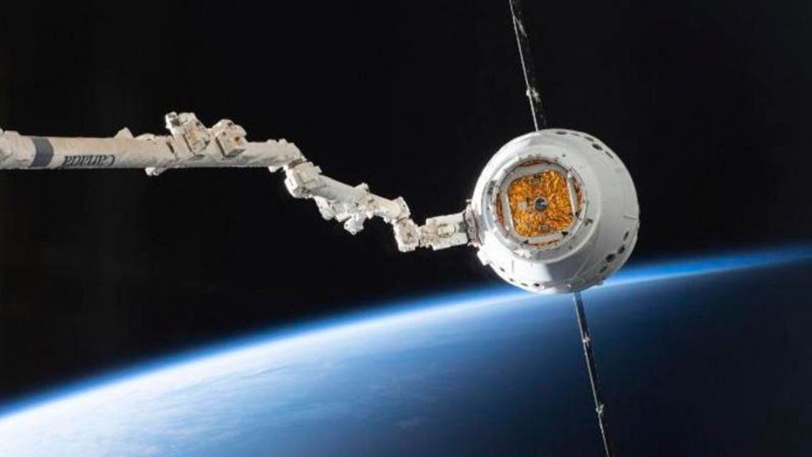 In this image provided by NASA, the SpaceX Dragon capsule arrives at the International Space Station, Sunday, Dec. 8, 2019. The Dragon capsule arrived at the orbiting outpost Sunday, delivering “mighty mice,” pest-killing worms and a smart, empathetic robot. (NASA via AP)