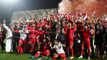 Bahrain players and coaching staff celebrate winning the Gulf Cup after the match. (Reuters)
