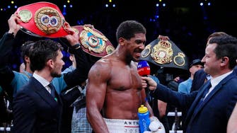 Clash on the Dunes: British challenger Joshua takes back heavyweight titles