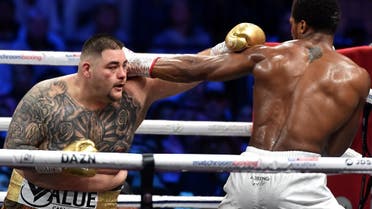 British boxer Anthony Joshua (white trunks) competes with Mexican-American boxer Andy Ruiz Jr (golden trunks) during the heavyweight boxing match in Diriya, near the Saudi capital Riyadh, dubbed “Clash on the Dunes.” (AFP)