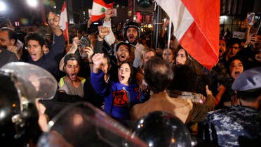 Anti-government protesters shout slogans during ongoing protests against the Lebanese political class and the financial crisis, in Beirut, Lebanon, Wednesday, Dec. 4, 2019 (AP)