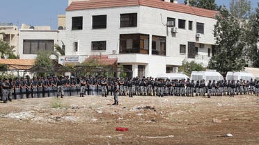 Jordanian riot police take position near the Israeli Embassy in the capital Amman during a protest in solidarity with the Palestinians, on October 9, 2015. (AFP)