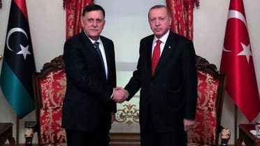 Fayez al-Sarraj, whose retinue were reportedly in clashes, with Turkey's President Recep Tayyip Erdogan on November 27, 2019. (AP) 