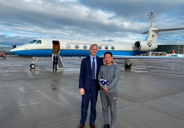 U.S. special representative for Iran, Brian Hook stands with Xiyue Wang in Zurich, Switzerland on Saturday, Dec. 7, 2019. (AP)