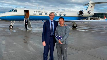 U.S. special representative for Iran, Brian Hook stands with Xiyue Wang in Zurich, Switzerland on Saturday, Dec. 7, 2019. In a trade conducted in Zurich, Iranian officials handed over Chinese-American graduate student Xiyue Wang, detained in Tehran since 2016, (AP)