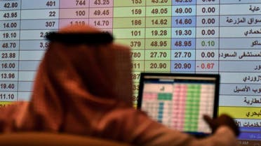 A Saudi broker monitors the stock market at the Arab National Bank in the Saudi capital Riyadh. (File photo: AFP)