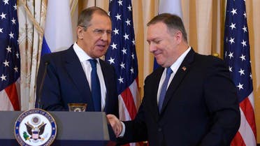 US Secretary of State Mike Pompeo (R) shakes hands with Russian Foreign Minister Sergey Lavrov during a press conference at the US State Department in Washington, DC on December 10, 2019. (AFP)