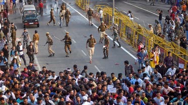Police chase away demonstrators during a protest against Citizenship Amendment Bill (CAB), that seeks to give citizenship to religious minorities persecuted in neighbouring Muslim countries, in Guwahati, India, December 11, 2019. (Reuters)