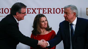 Canadian Deputy Prime Minister Chrystia Freeland looks on while Mexico's President Andres Manuel Lopez Obrador shakes hands with Mexico's Foreign Minister Marcelo Ebrard, during a meeting at the Presidential Palace, in Mexico City, Mexico December 10, 2019. 