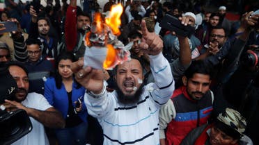 Demonstrators burn copies of Citizenship Amendment Bill, a bill that seeks to give citizenship to religious minorities persecuted in neighbouring Muslim countries, during a protest in New Delhi, India, December 10, 2019. REUTERS