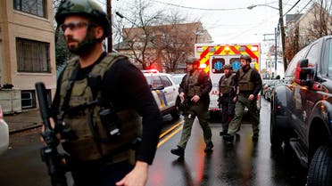 Police officers arrive at the scene following reports of gunfire, on December 10, 2019, in Jersey City, New Jersey. (AP)