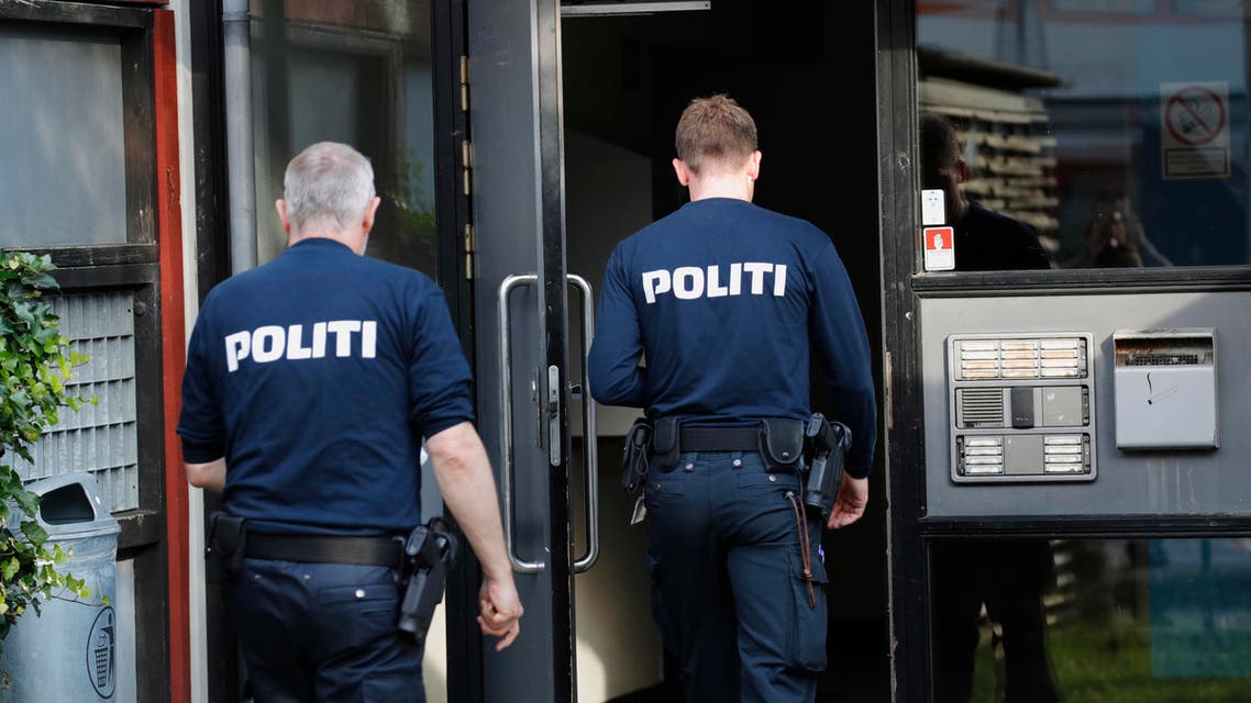Police officers walk outside an apartment building cordoned off, in Brondby Strand, Copenhagen, Denmark, Thursday, Sept. 21, 2017. (AP)