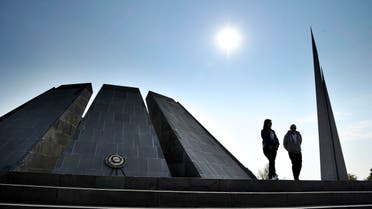 A couple walk at the Tzitzernakaberd memorial to the victims of mass killings by Ottoman Turks, in the Armenian capital Yerevan, Armenia, Wednesday, Oct. 30, 2019. (AP)