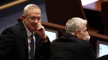 Blue and White party leaders Benny Gantz, left, and Yair Lapid attend a Knesset session in Jerusalem, Wednesday, Dec. 11, 2019. (AP)