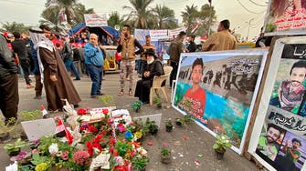 Officials: Protesters hang gunman in Baghdad square