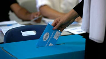 A member of the Israeli Druze community casts her ballot during Israel's parliamentary elections on September 17, 2019, in Daliyat al-karmel in northern Israel.