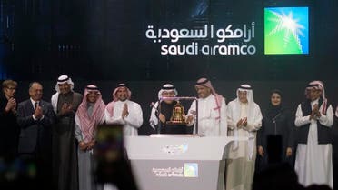 Saudi Arabia's state-owned oil company Saudi Armco and stock market officials celebrate during the official ceremony marking the debut of Aramco's IPO. (File photo: AP)