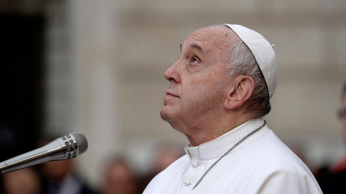 Pope Francis looks up to pray in front of the statue of the Virgin Mary, near Rome's Spanish Steps, Sunday, Dec. 8, 2019 (AP)