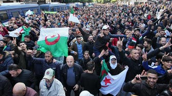 Algerians mass in capital in protest at new president